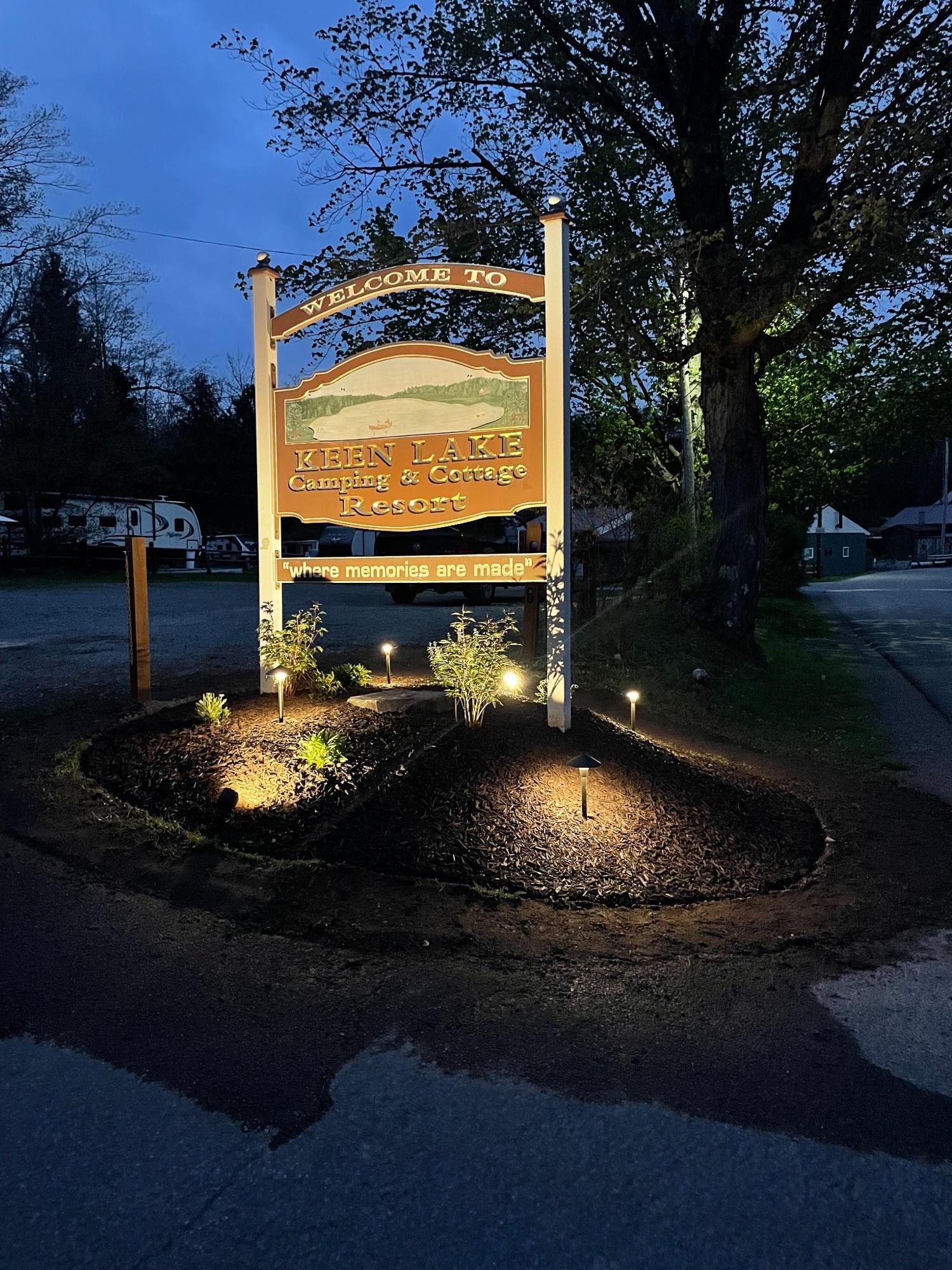 Landscape lighting installation at dusk