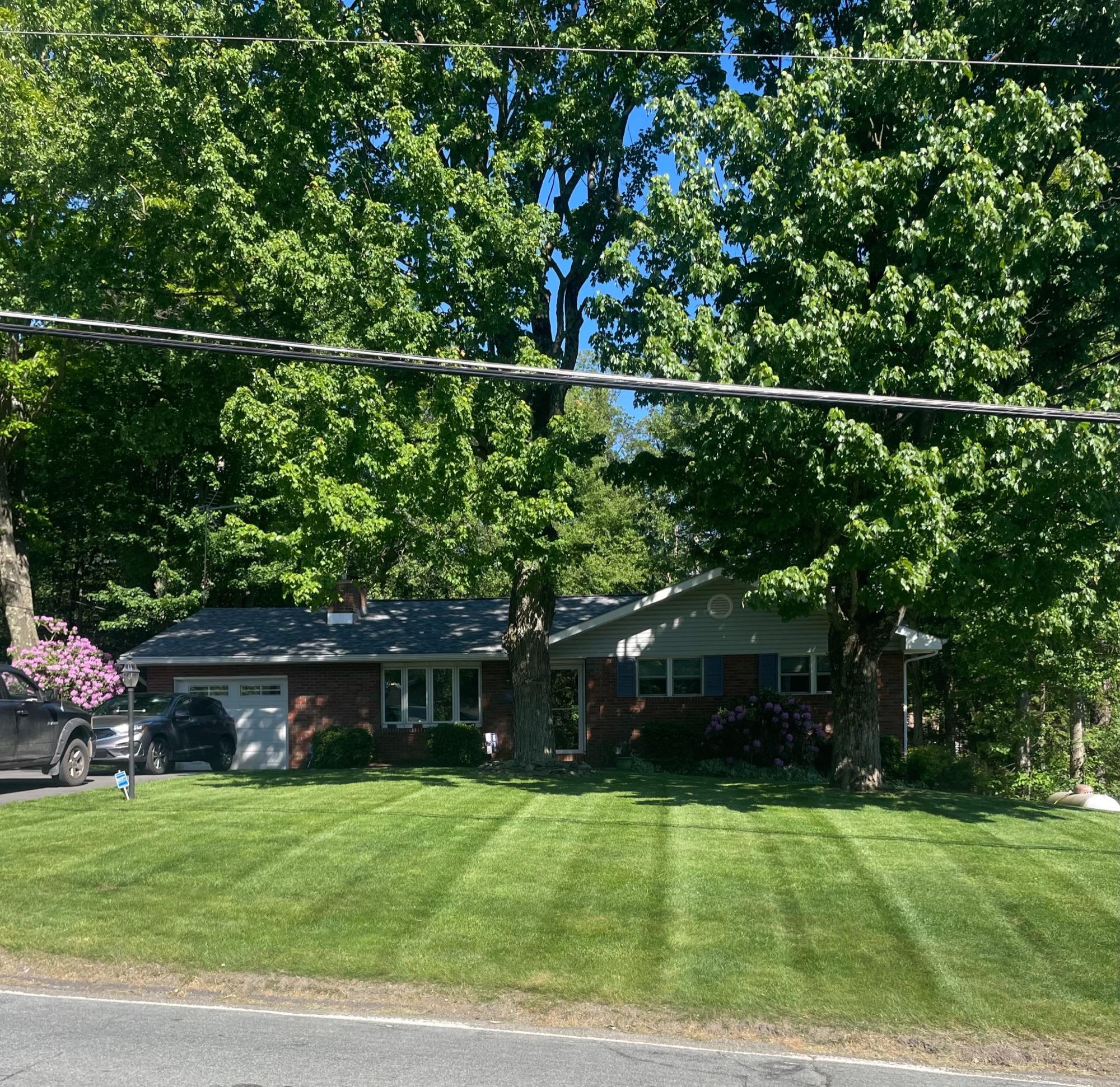 Lush striped lawn from weekly mowing service